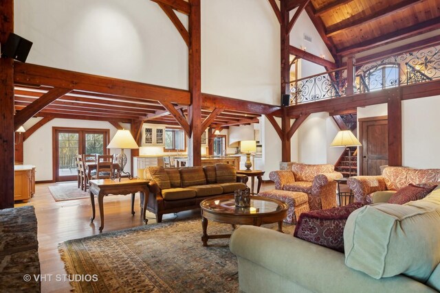 236 Steeplechase Rd, Barrington Hills, IL 60010 - living room with beam ceiling, wood finished floors, high vaulted ceiling, stairs, and wood ceiling