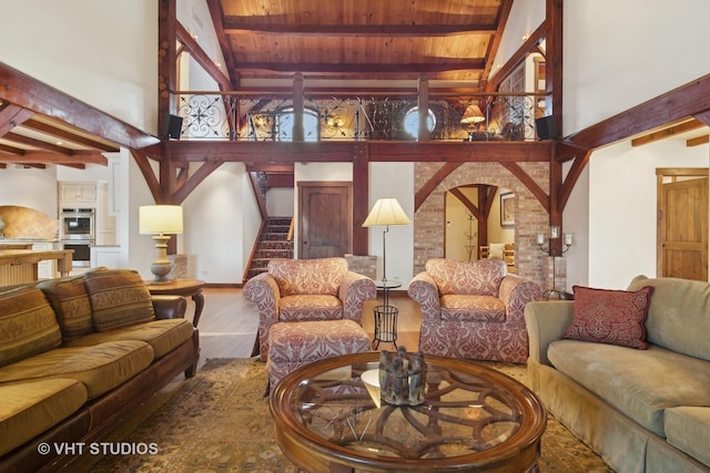 236 Steeplechase Rd, Barrington Hills, IL 60010 - living area with beamed ceiling, high vaulted ceiling, wood finished floors, stairway, and wood ceiling
