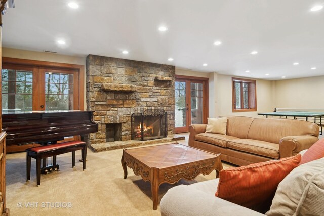 236 Steeplechase Rd, Barrington Hills, IL 60010 - living area with recessed lighting, light colored carpet, a stone fireplace, and french doors
