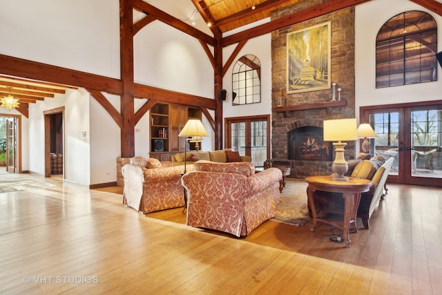 236 Steeplechase Rd, Barrington Hills, IL 60010 - living area with high vaulted ceiling, french doors, wood-type flooring, beamed ceiling, and plenty of natural light