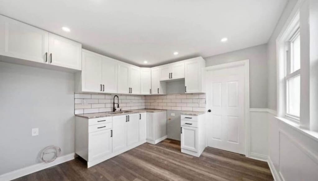 14808 Leavitt Ave, Harvey, IL 60426 - kitchen with dark wood-style floors, decorative backsplash, a sink, white cabinetry, and recessed lighting