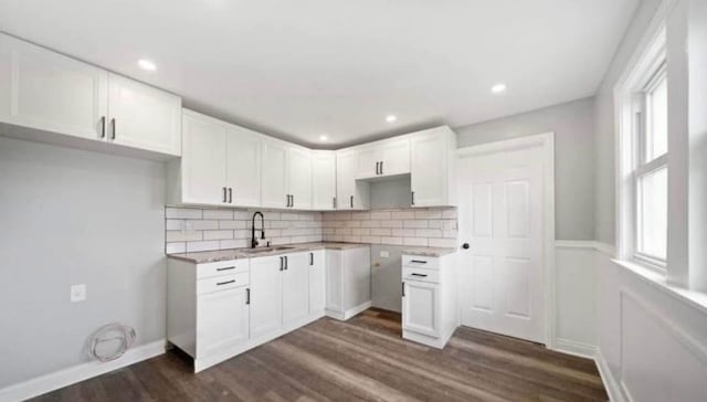 14808 Leavitt Ave, Harvey, IL 60426 - kitchen with dark wood-style floors, decorative backsplash, a sink, white cabinetry, and recessed lighting