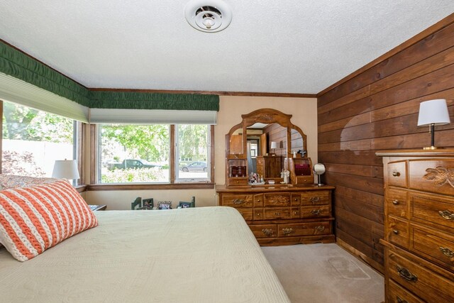 4904 Spring Rd, Oak Lawn, IL 60453 - carpeted bedroom with wooden walls, a textured ceiling, and crown molding