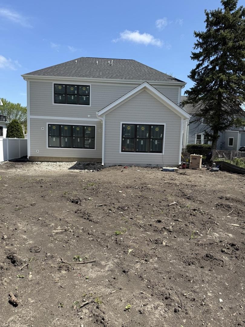 back of property with fence