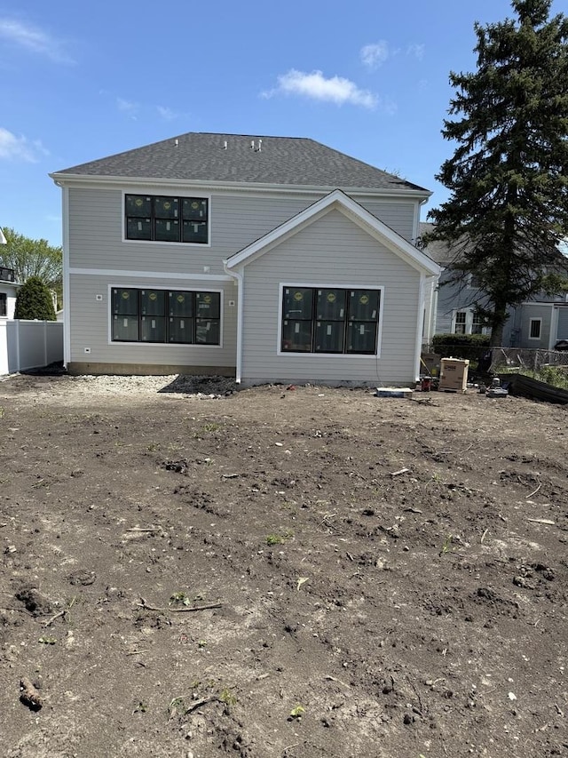 back of property with fence
