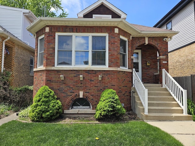 view of front of house with brick siding