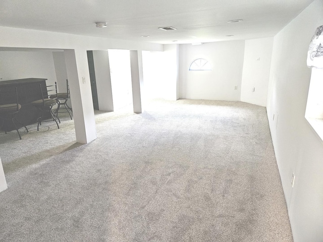 basement featuring carpet floors