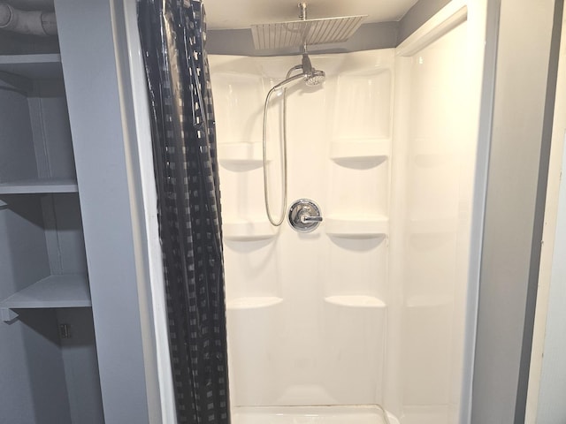 full bath featuring a shower stall