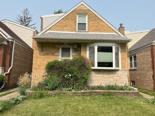 5236 N Mobile Ave, Chicago, IL 60630 - bungalow with roof with shingles, brick siding, and stone siding