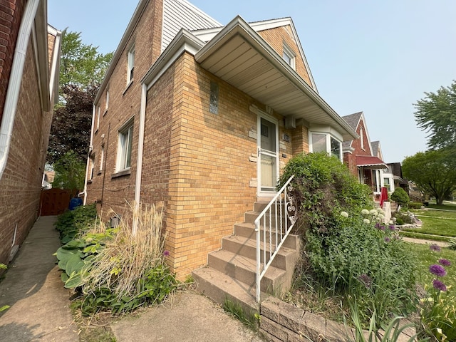 5236 N Mobile Ave, Chicago, IL 60630 - view of property exterior featuring brick siding and entry steps