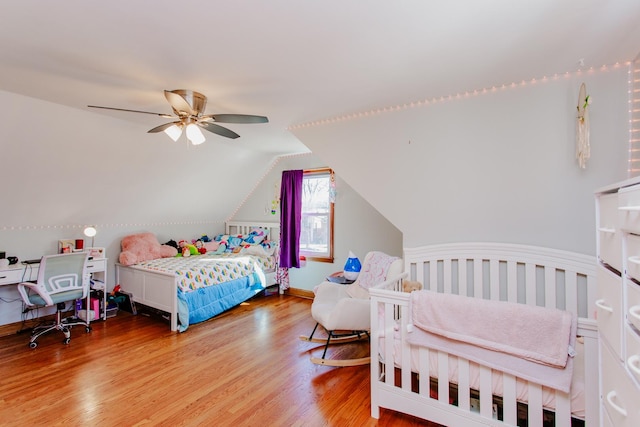 5236 N Mobile Ave, Chicago, IL 60630 - bedroom featuring wood finished floors, lofted ceiling, and ceiling fan