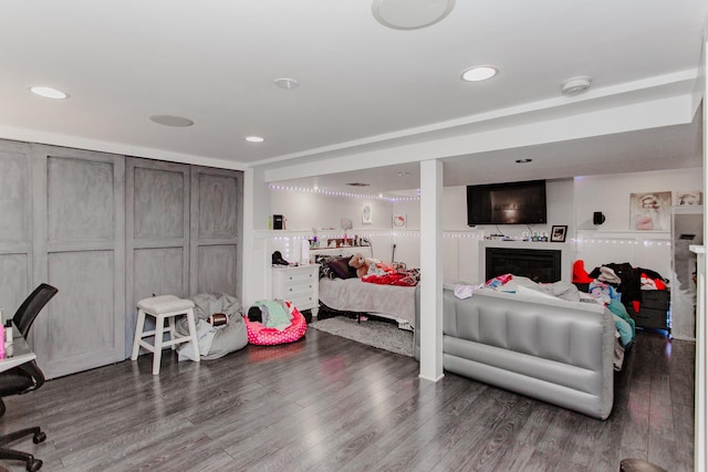 5236 N Mobile Ave, Chicago, IL 60630 - bedroom with wood finished floors, recessed lighting, and a fireplace