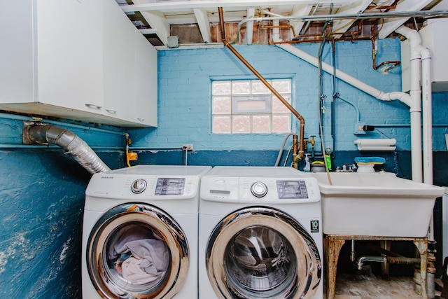 5236 N Mobile Ave, Chicago, IL 60630 - laundry room featuring washer and clothes dryer and cabinet space