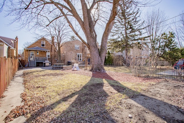 5236 N Mobile Ave, Chicago, IL 60630 - fenced yard with a fire pit and a deck