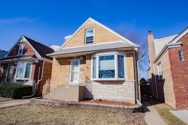 5236 N Mobile Ave, Chicago, IL 60630 - view of front of house featuring stone siding and roof with shingles