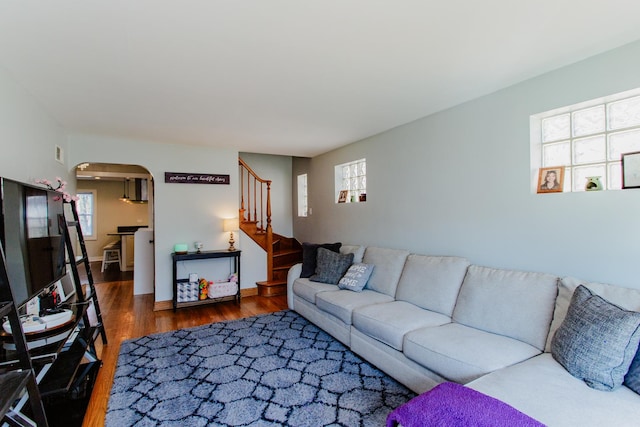 5236 N Mobile Ave, Chicago, IL 60630 - living area featuring arched walkways, healthy amount of natural light, wood finished floors, and stairs