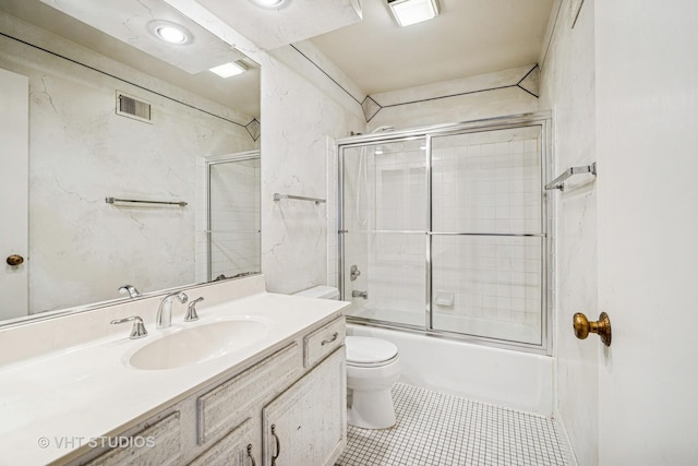 210 Constance Ln, Northbrook, IL 60062 - bathroom featuring toilet, tile patterned flooring, vanity, and enclosed tub / shower combo