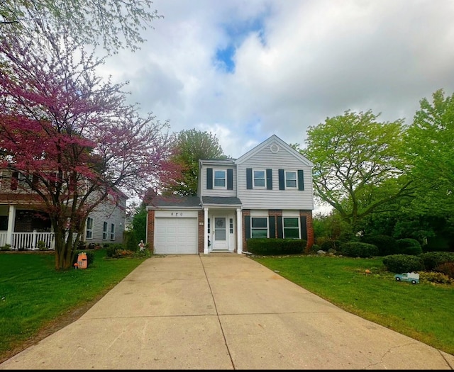 620 Teton Cir, Carol Stream, IL 60188 - traditional-style house with brick siding, a garage, driveway, and a front yard