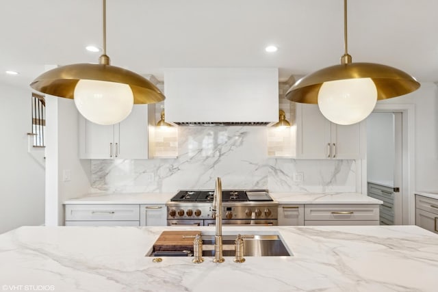 4300 Franklin Ave, Western Springs, IL 60558 - kitchen with high end stainless steel range, custom range hood, backsplash, light stone countertops, and recessed lighting