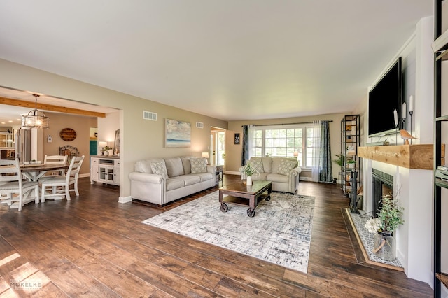7500 US Highway 34, Oswego, IL 60543 - living room featuring a fireplace, dark wood-style floors, and baseboards