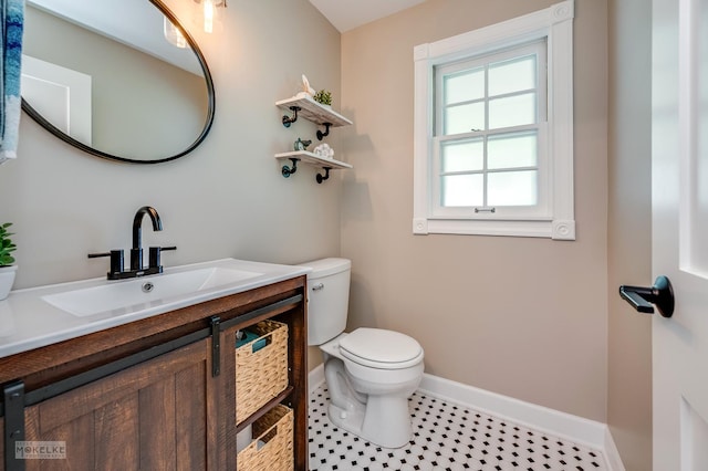 7500 US Highway 34, Oswego, IL 60543 - half bath featuring toilet, baseboards, vanity, and tile patterned floors