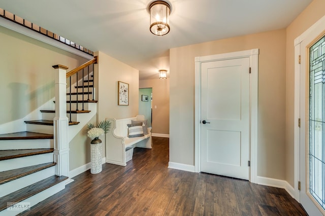 7500 US Highway 34, Oswego, IL 60543 - entryway with dark wood finished floors, stairway, and baseboards