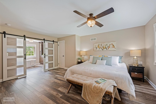 7500 US Highway 34, Oswego, IL 60543 - bedroom featuring a barn door, wood finished floors, baseboards, and ceiling fan
