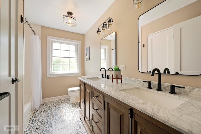 7500 US Highway 34, Oswego, IL 60543 - full bath with toilet, baseboards, double vanity, tile patterned floors, and shower / bath combo with shower curtain