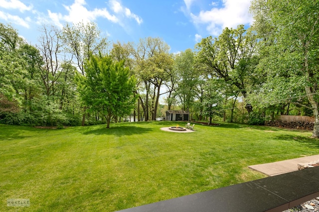 7500 US Highway 34, Oswego, IL 60543 - view of grassy yard with a fire pit