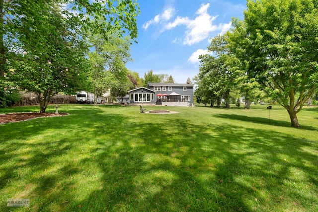 7500 US Highway 34, Oswego, IL 60543 - view of green lawn featuring a fire pit