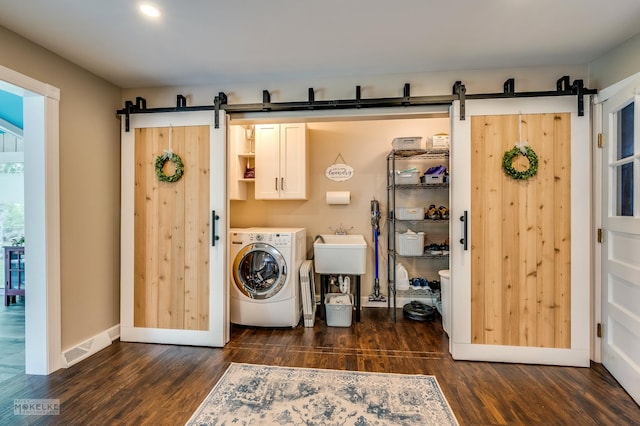 7500 US Highway 34, Oswego, IL 60543 - washroom with a barn door, cabinet space, and dark wood-style floors
