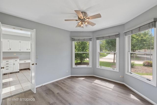 10428 Morningside Ct, Orland Park, IL 60462 - empty room featuring a ceiling fan, light wood-style flooring, and baseboards