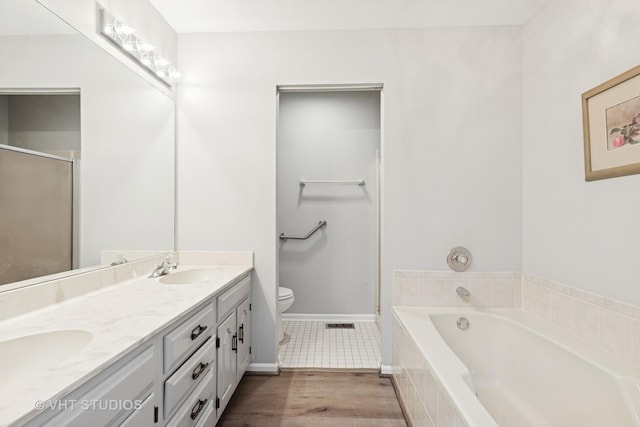 10428 Morningside Ct, Orland Park, IL 60462 - bathroom with a bath, double vanity, toilet, a shower with door, and baseboards