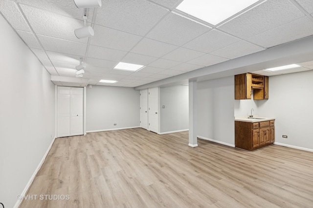 10428 Morningside Ct, Orland Park, IL 60462 - finished below grade area featuring a drop ceiling, light wood finished floors, baseboards, and a sink