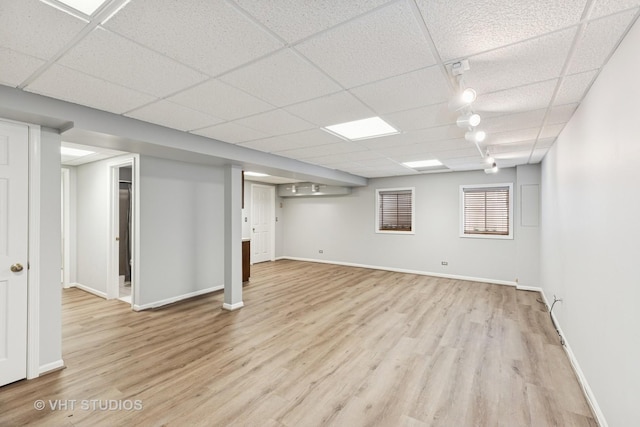 10428 Morningside Ct, Orland Park, IL 60462 - basement featuring light wood-style floors, a drop ceiling, baseboards, and track lighting