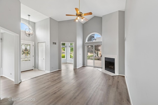 10428 Morningside Ct, Orland Park, IL 60462 - entrance foyer with high vaulted ceiling, wood finished floors, a fireplace, and baseboards