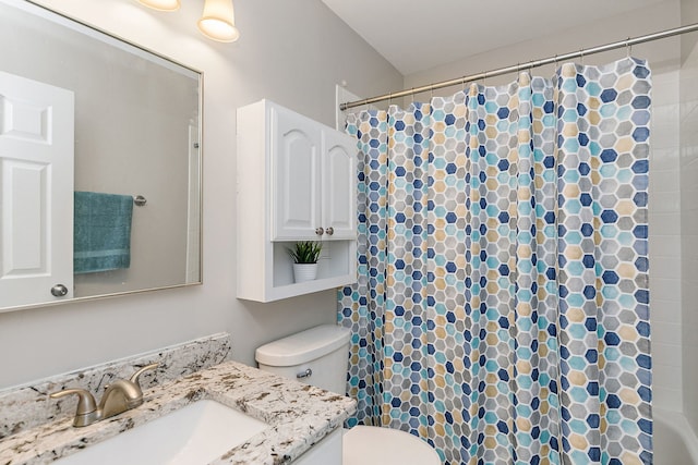 bathroom with toilet, curtained shower, and vanity