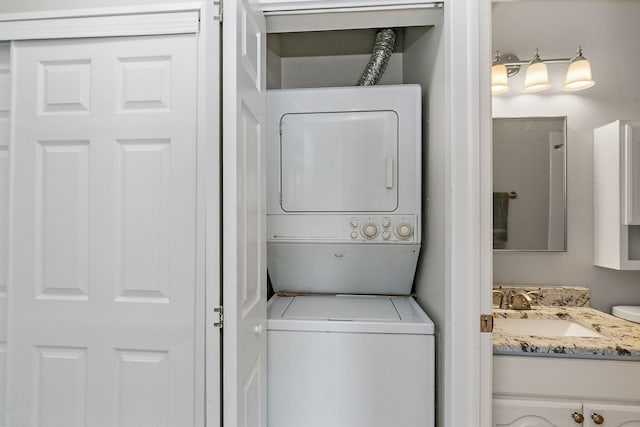 laundry area with estacked washer and dryer