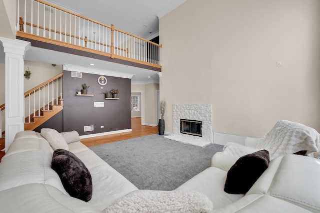 39W027 Dean St, Saint Charles, IL 60175 - living area featuring ornamental molding, a towering ceiling, stairs, wood finished floors, and baseboards