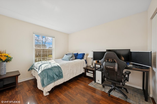 bedroom with wood finished floors, a desk, and baseboards