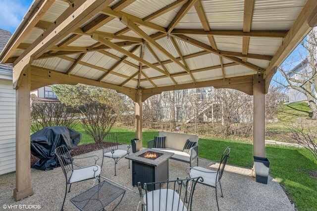 view of patio / terrace featuring an outdoor fire pit, a gazebo, and grilling area