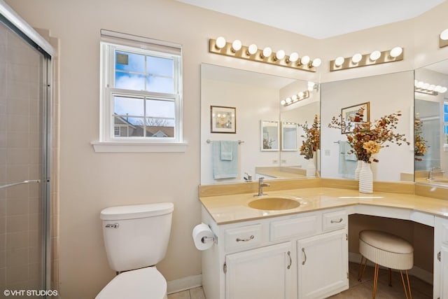 bathroom featuring toilet, vanity, tile patterned flooring, and an enclosed shower