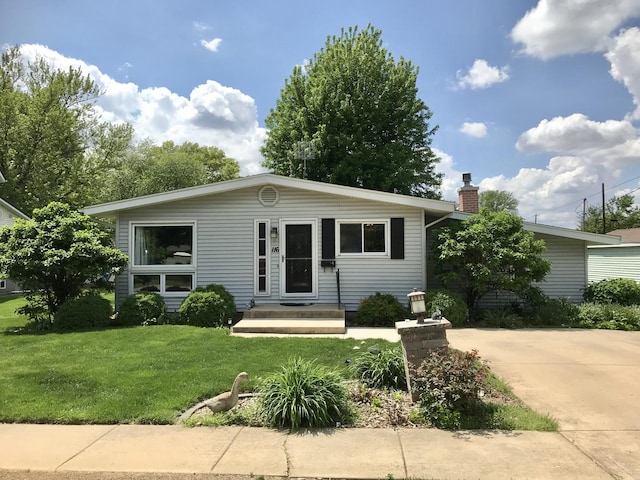 116 N Beech St, Princeton, IL 61356 - view of front of house with a front yard and a chimney