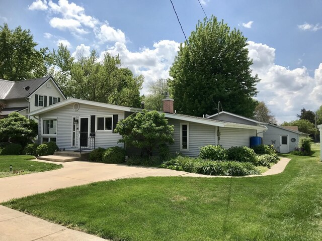 116 N Beech St, Princeton, IL 61356 - view of front of home featuring a front yard and a chimney