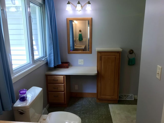 116 N Beech St, Princeton, IL 61356 - bathroom with toilet and baseboards