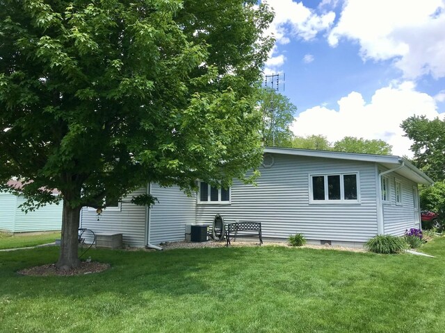 116 N Beech St, Princeton, IL 61356 - back of house with a lawn and central AC unit