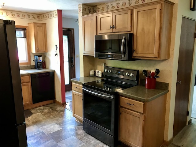 116 N Beech St, Princeton, IL 61356 - kitchen with black appliances and dark countertops