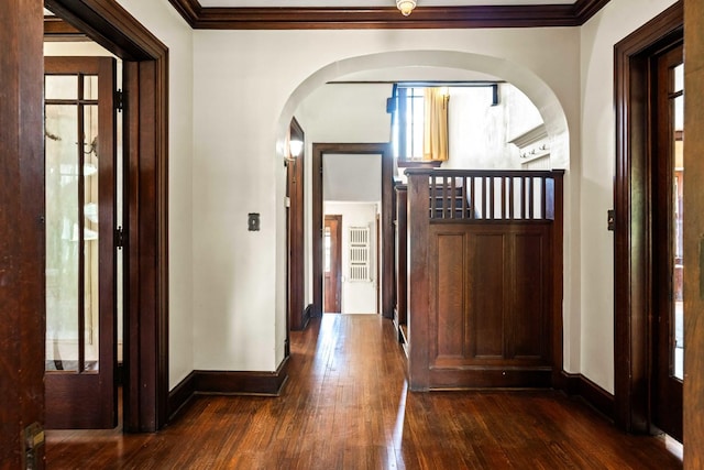 546 Elmwood Ct, El Paso, IL 61738 - entrance foyer with dark wood-style flooring, baseboards, arched walkways, healthy amount of natural light, and crown molding
