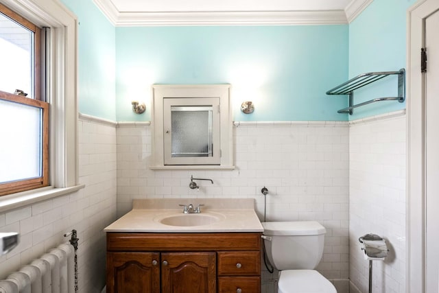 546 Elmwood Ct, El Paso, IL 61738 - bathroom featuring tile walls, radiator heating unit, plenty of natural light, ornamental molding, and toilet