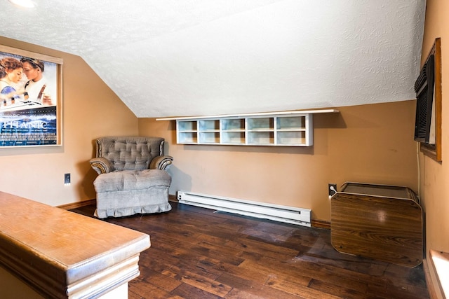 546 Elmwood Ct, El Paso, IL 61738 - living area featuring a baseboard heating unit, vaulted ceiling, a textured ceiling, and hardwood / wood-style floors
